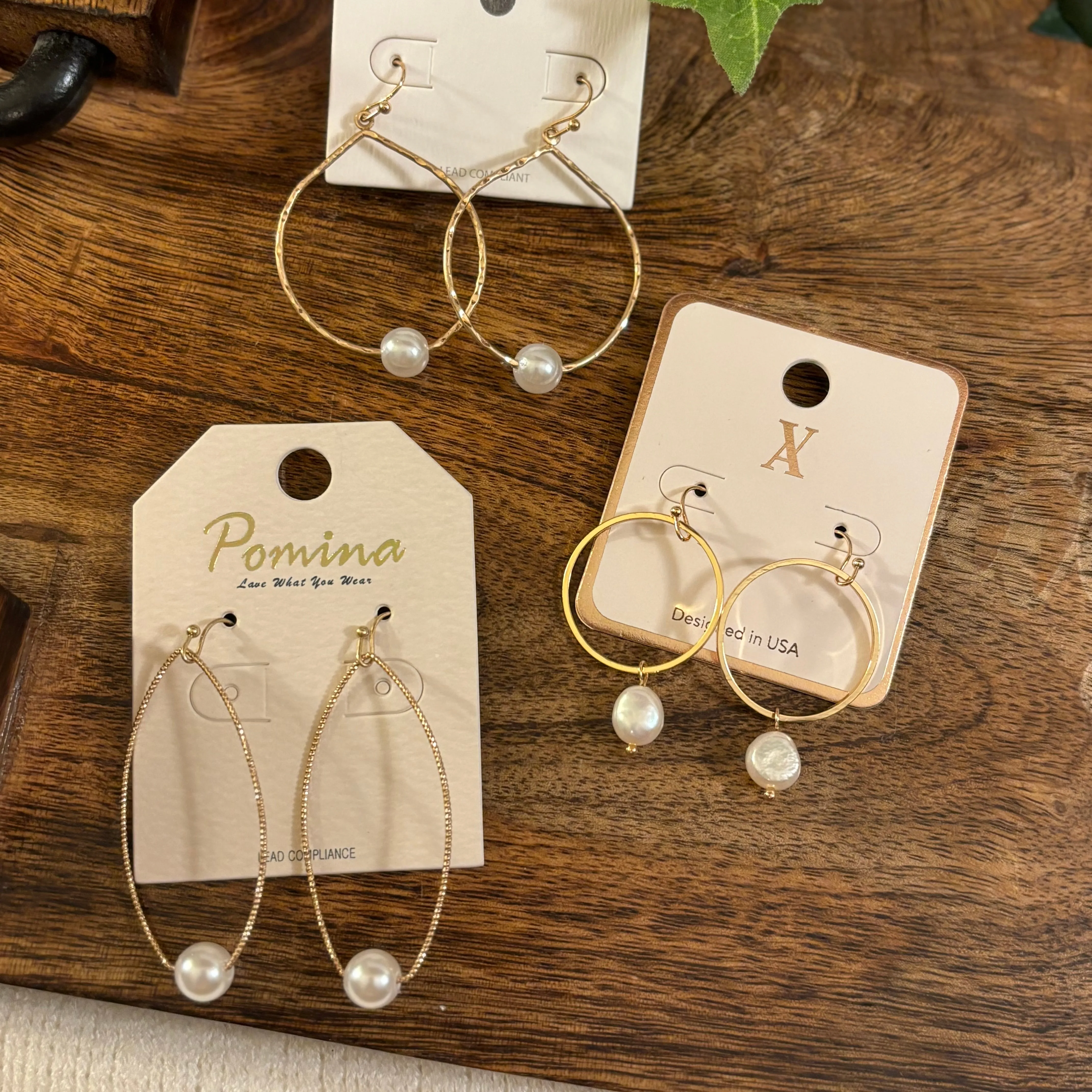 Gold Dangle Earrings Adorned with Pearls
